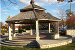 A gazebo on an ornate stone platform.